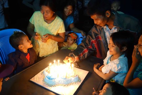 Birthday boy with his Spiderman cake