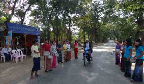 Women asking for donations for the monks